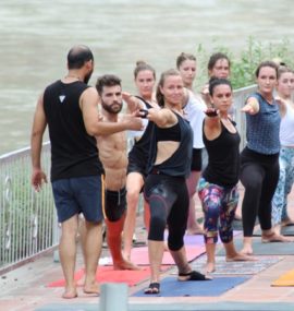 Mantra Yoga Meditation Students Practicing Yoga nearby Ganges